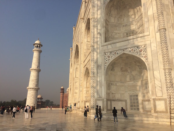 standing at the Taj Mahal